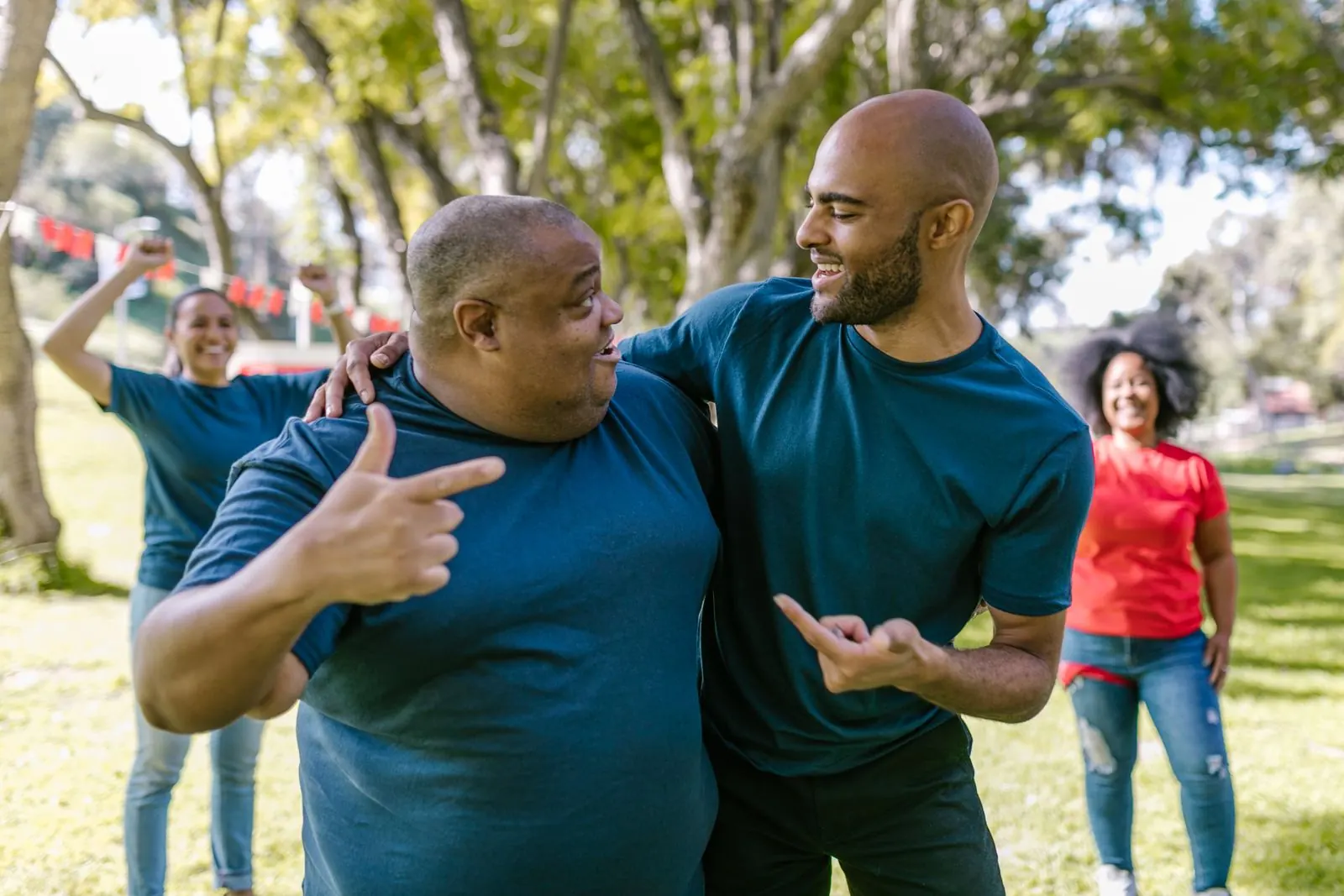 Friends laughing together outdoors in a park
